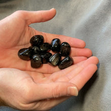 Load and play video in Gallery viewer, Arfvedsonite Tumbled Stones - 1/2 lb
